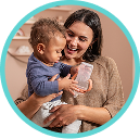 [Translate to English (Australia) (Reborn) nuk.com.au:] Mother with Baby and Learner Bottle