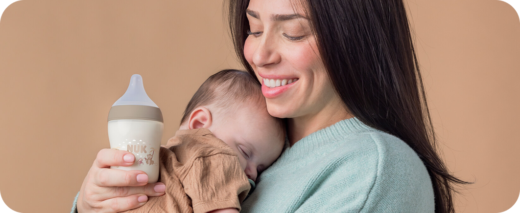 [Translate to English (Australia) (Reborn) nuk.com.au:] Mother with Baby and Babybottle